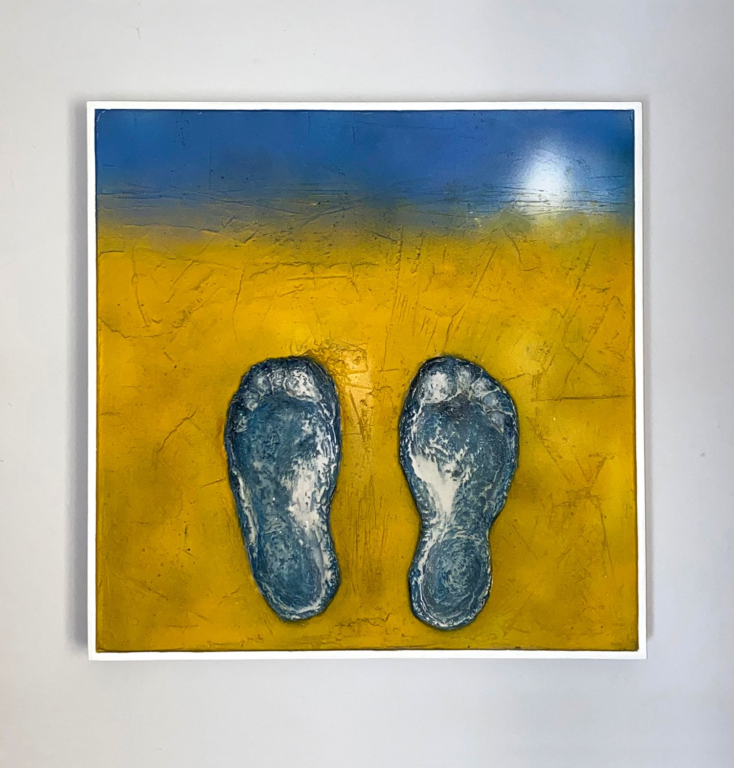 'Dunworly Beach I' mixed media painting on canvas. Blue foot imprints on a sandy yellow background.