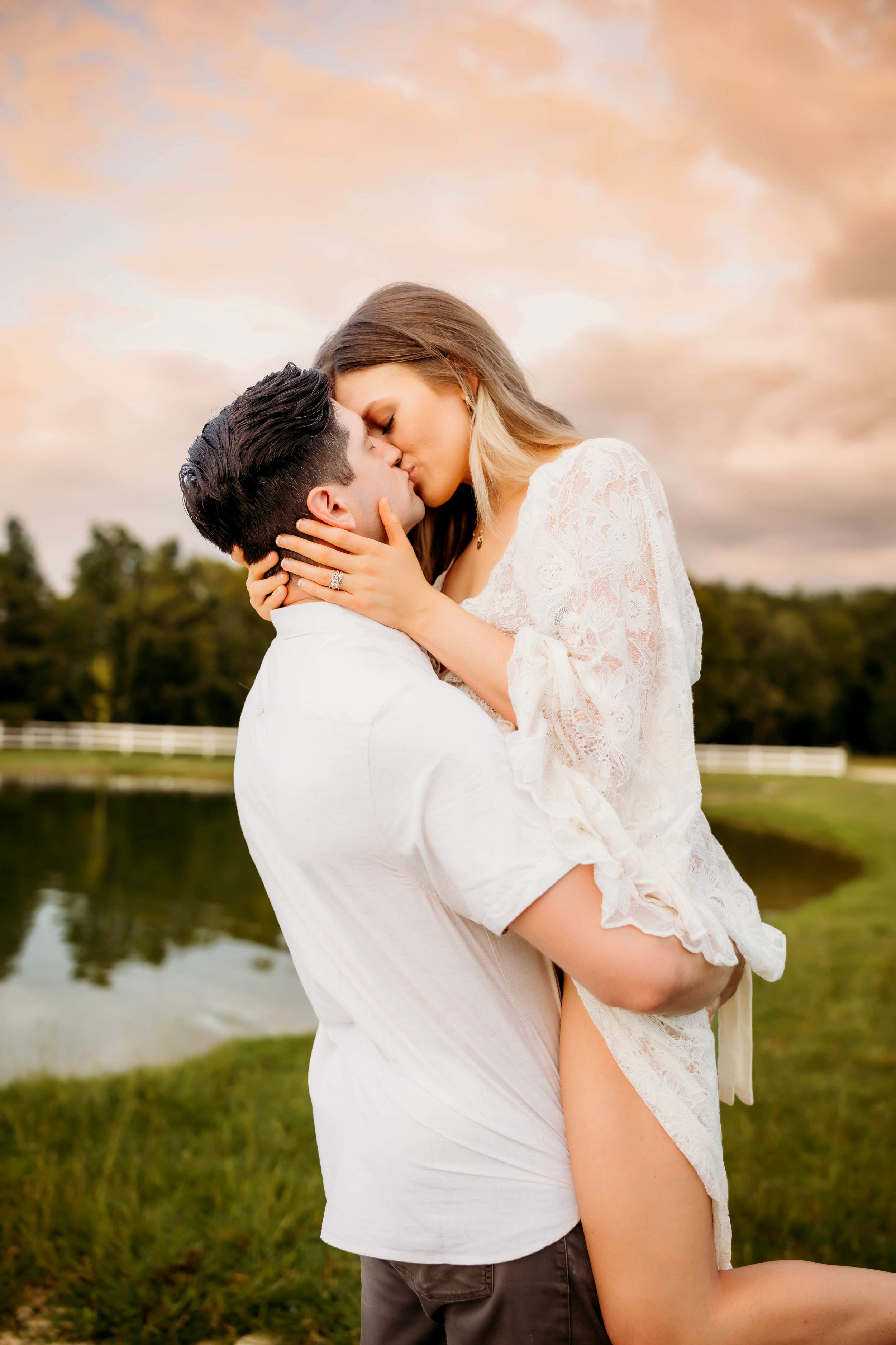 "Smiling couple posing in scenic Connecticut landscape"