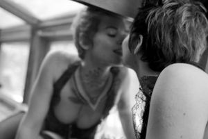 Artistic black and white intimate portrait of two people in soft focus.