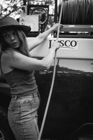 Black and white candid shot showing interaction with vintage Jesco equipment.