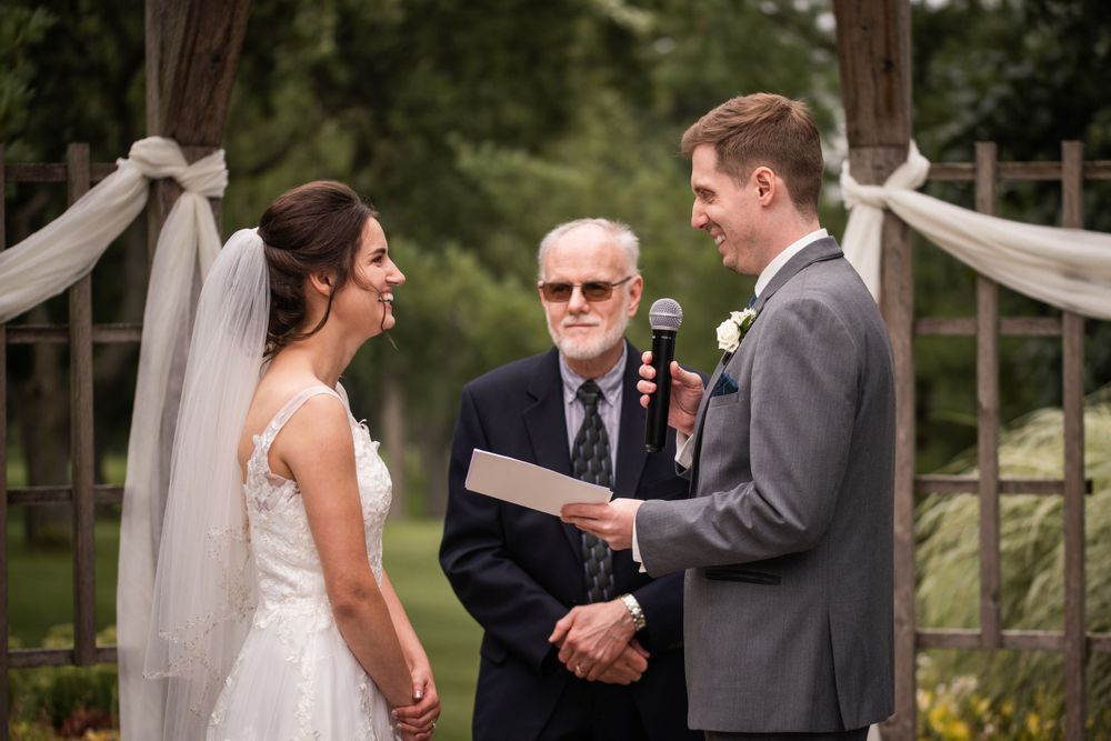 Exchange of vows outdoor wedding ceremony at Stratford Country Club