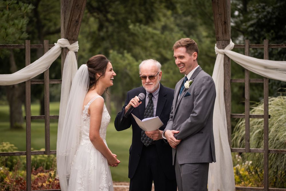 Exchange of vows outdoor wedding ceremony at Stratford Country Club