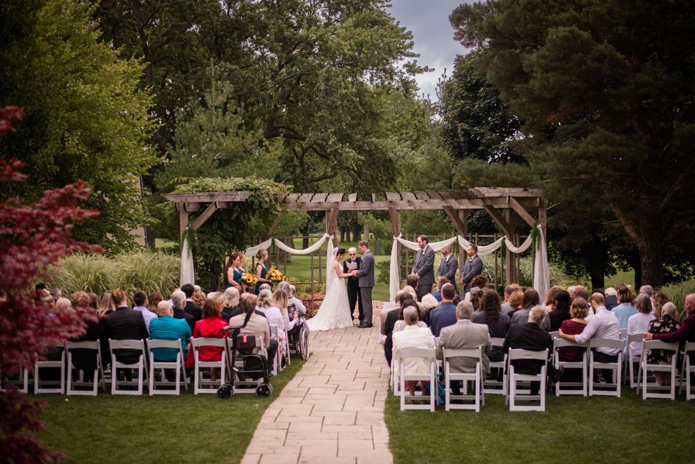 Wide shot outdoor wedding ceremony at Stratford Country Club