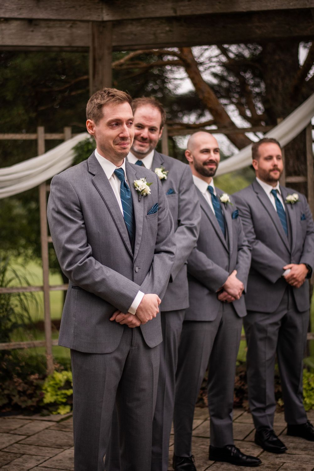 Grooms reaction to seeing bride walking down the aisle at Stratford Country Club wedding ceremony