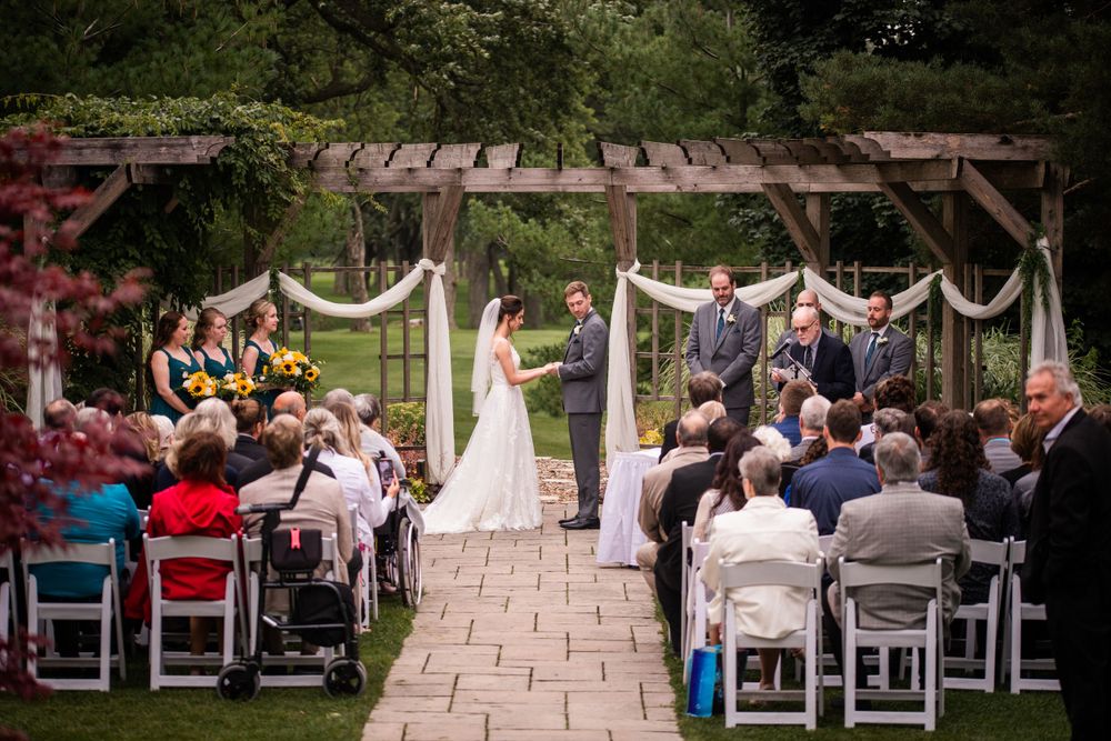 Wide shot outdoor wedding ceremony at Stratford Country Club