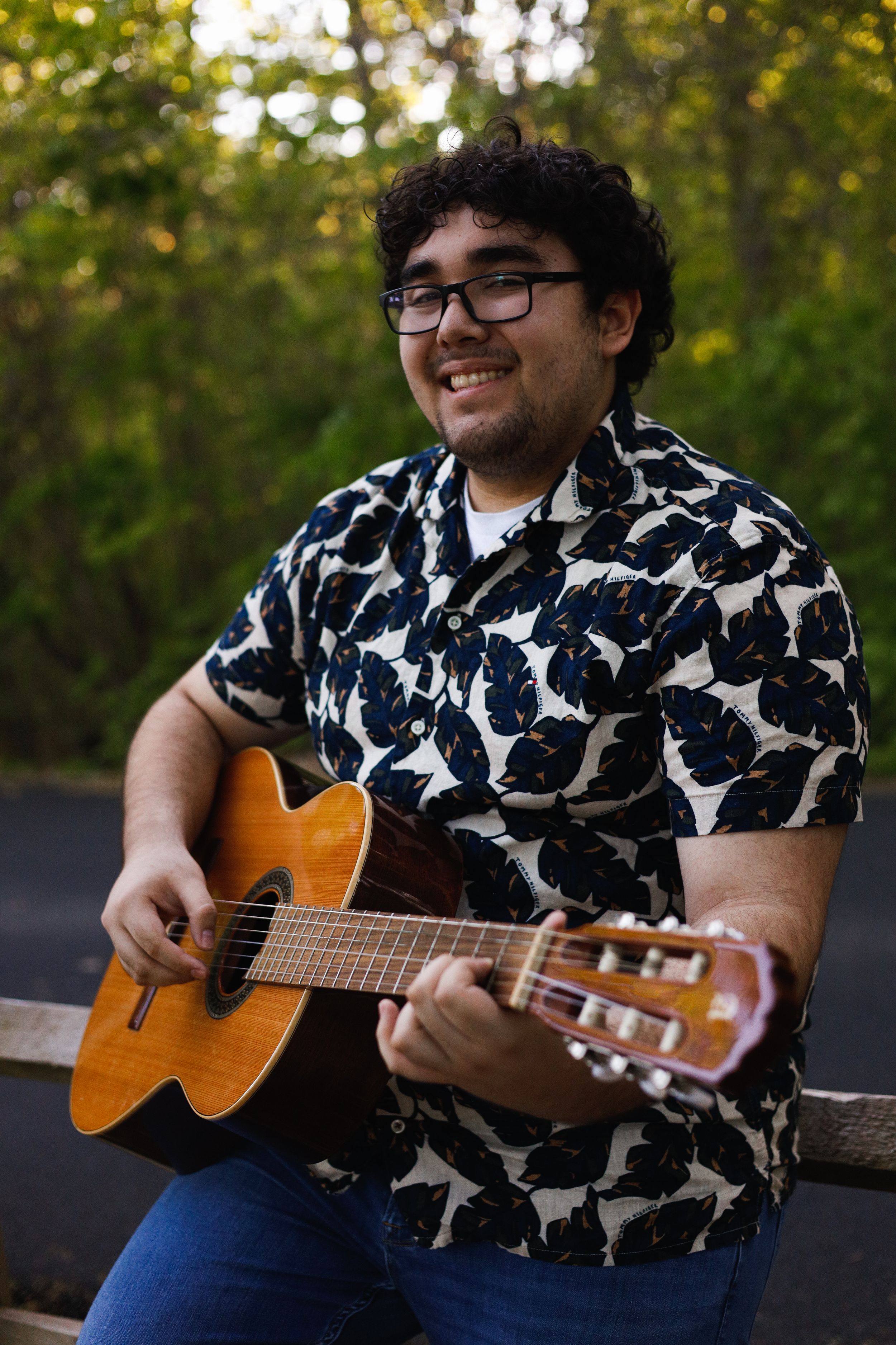 Creative portrait photo of a young man playing the guitar