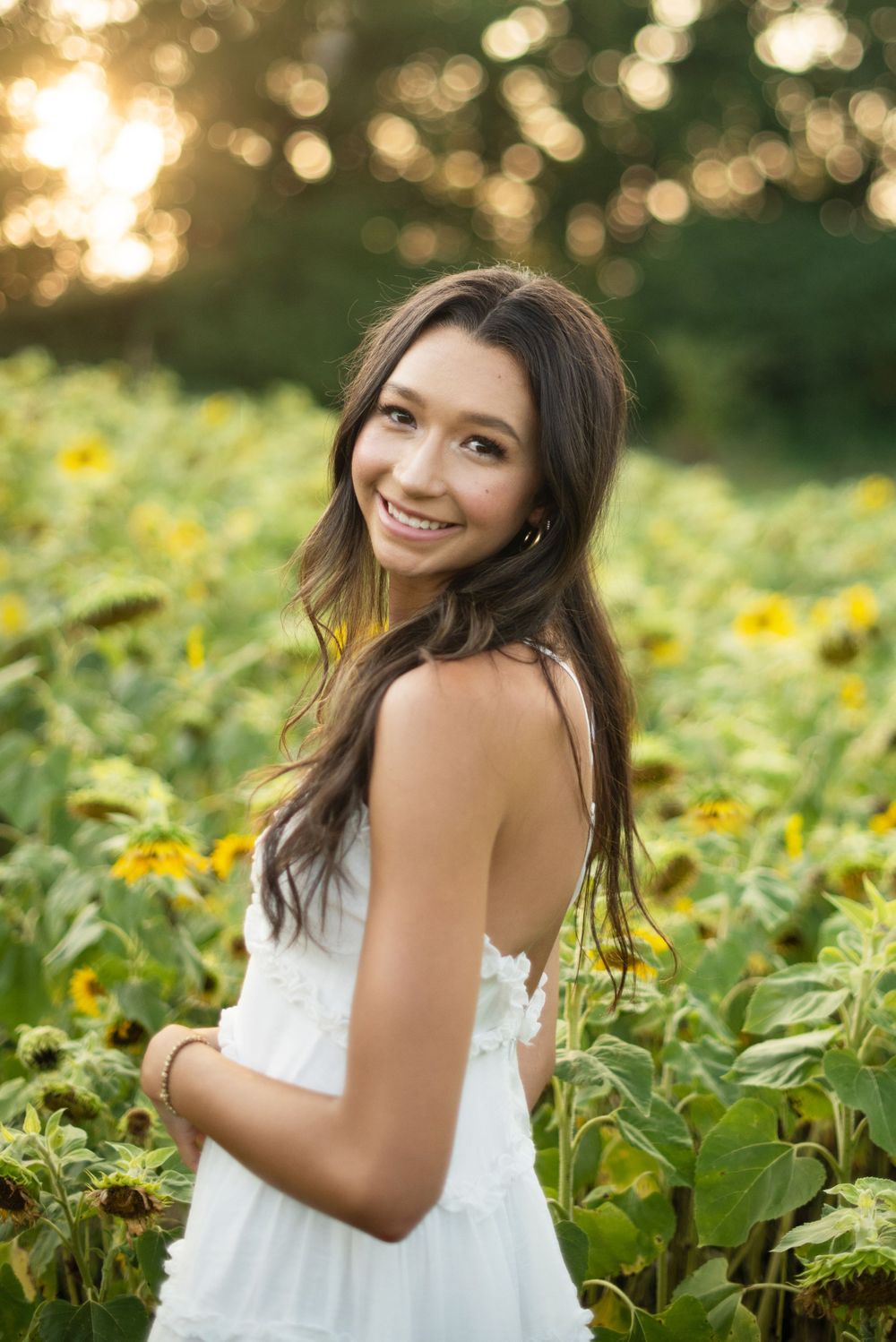 Spring Hill Senior Photographer at South40 farm with sunflowers