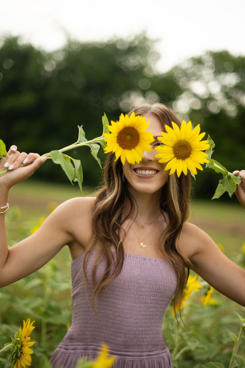 Franklin TN Senior Photographer captures senior in sunflower field.