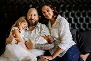 Family poses for newborn photoshoot