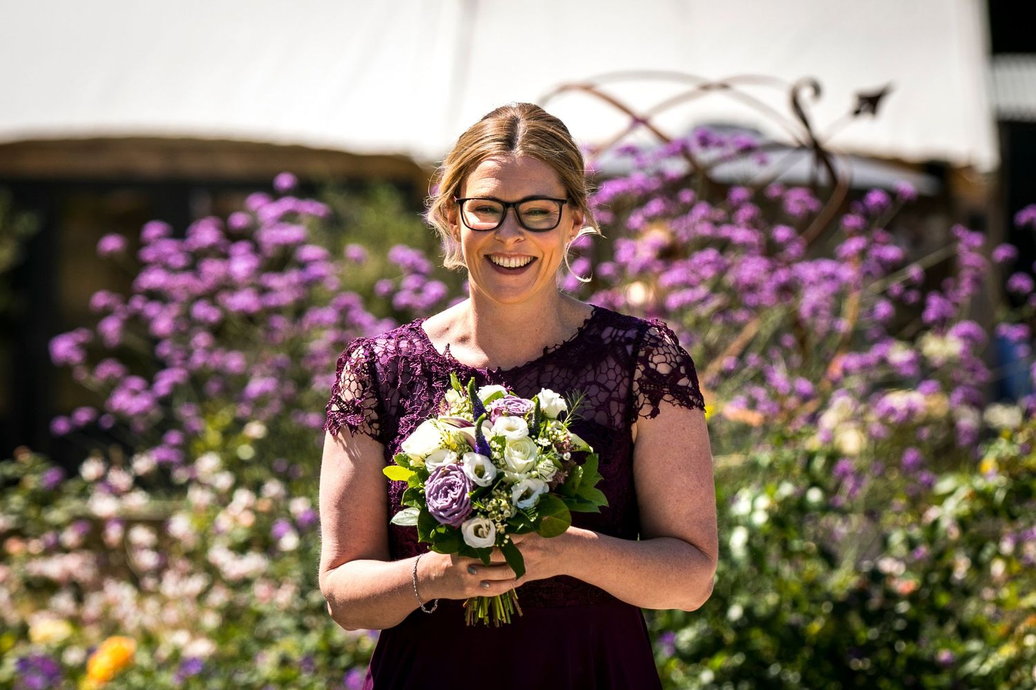 Beautiful purple and white flowers in a garden wedding setting.