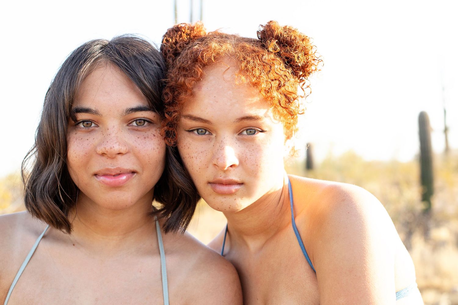 Sunset portrait series of two children in desert landscape with warm lighting.