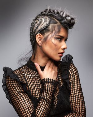 Braided up do on oriental girl.