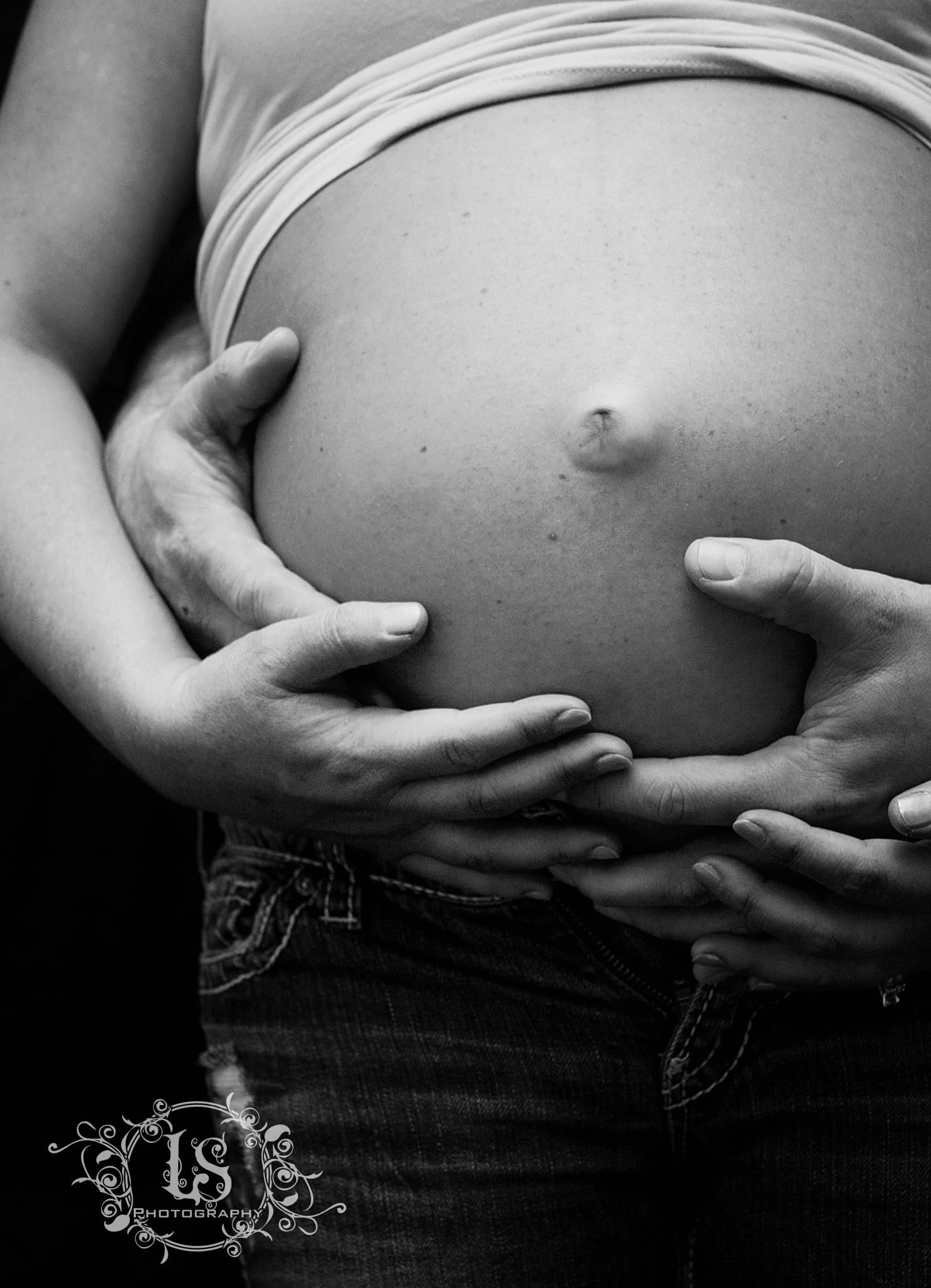 Series of artistic black and white photos showing hands cradling a pregnant belly.