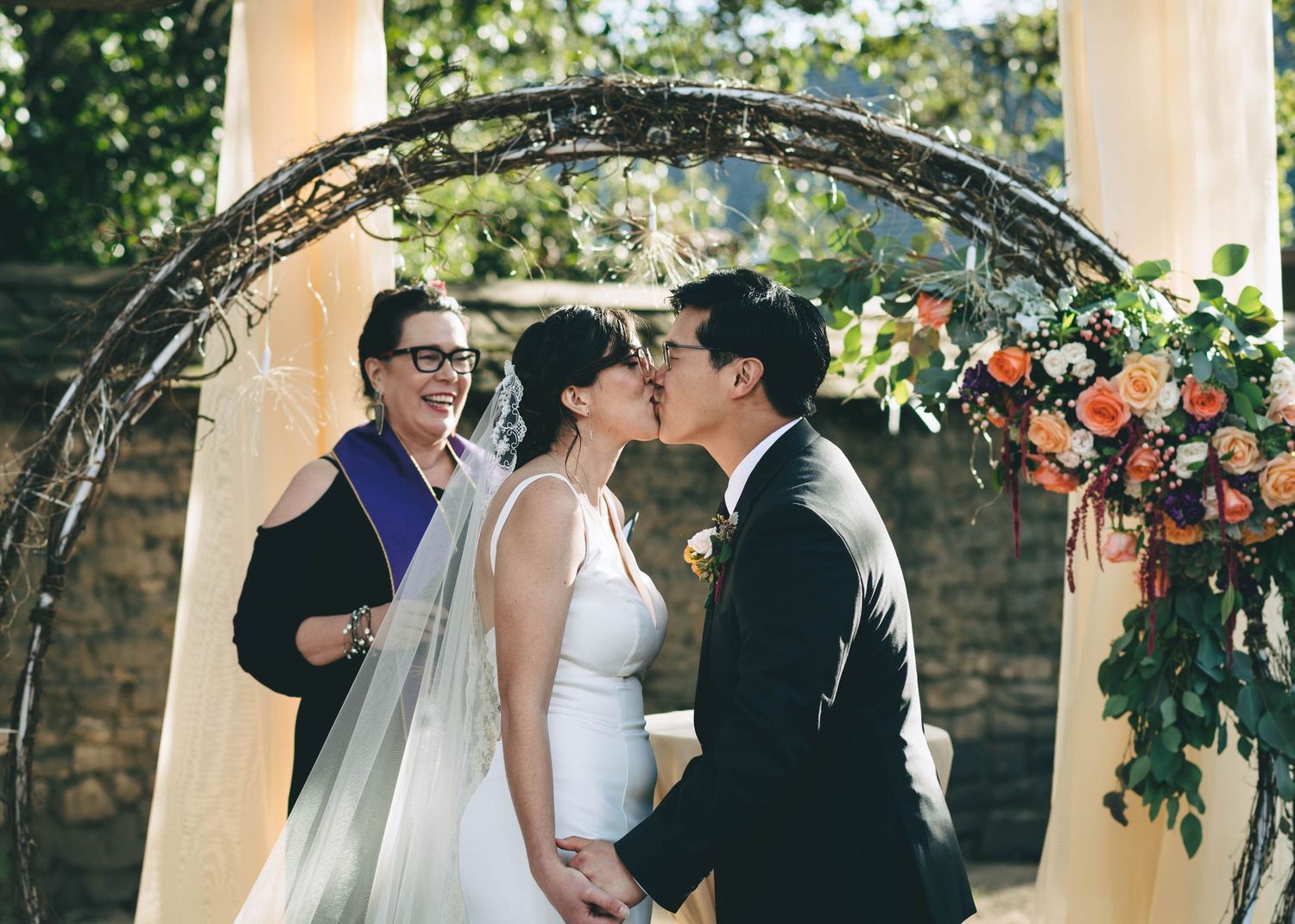 bride and groom have their first kiss as husband and wife