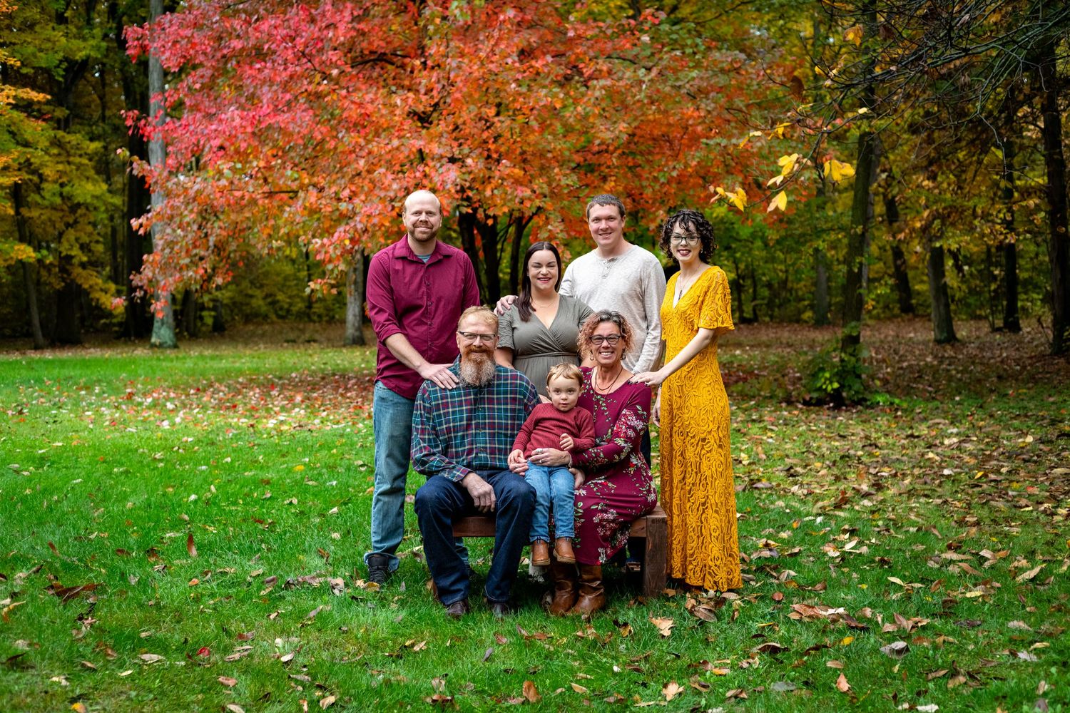 extending family photo in fall woods