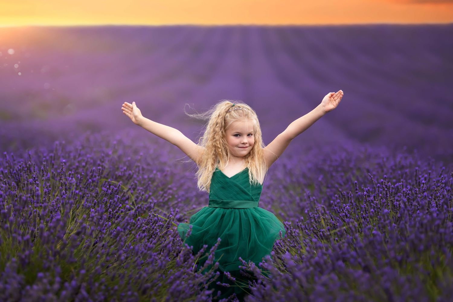 Joyful portraits in a vibrant purple lavender field during golden hour.