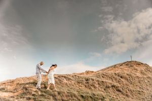 Wedding day adventures on the side of a hill in Bay View on a summers day.