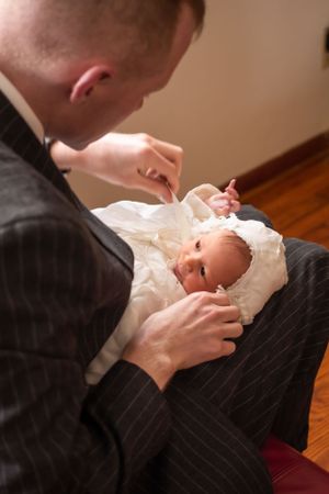 Infant baptism preparation moment in church.