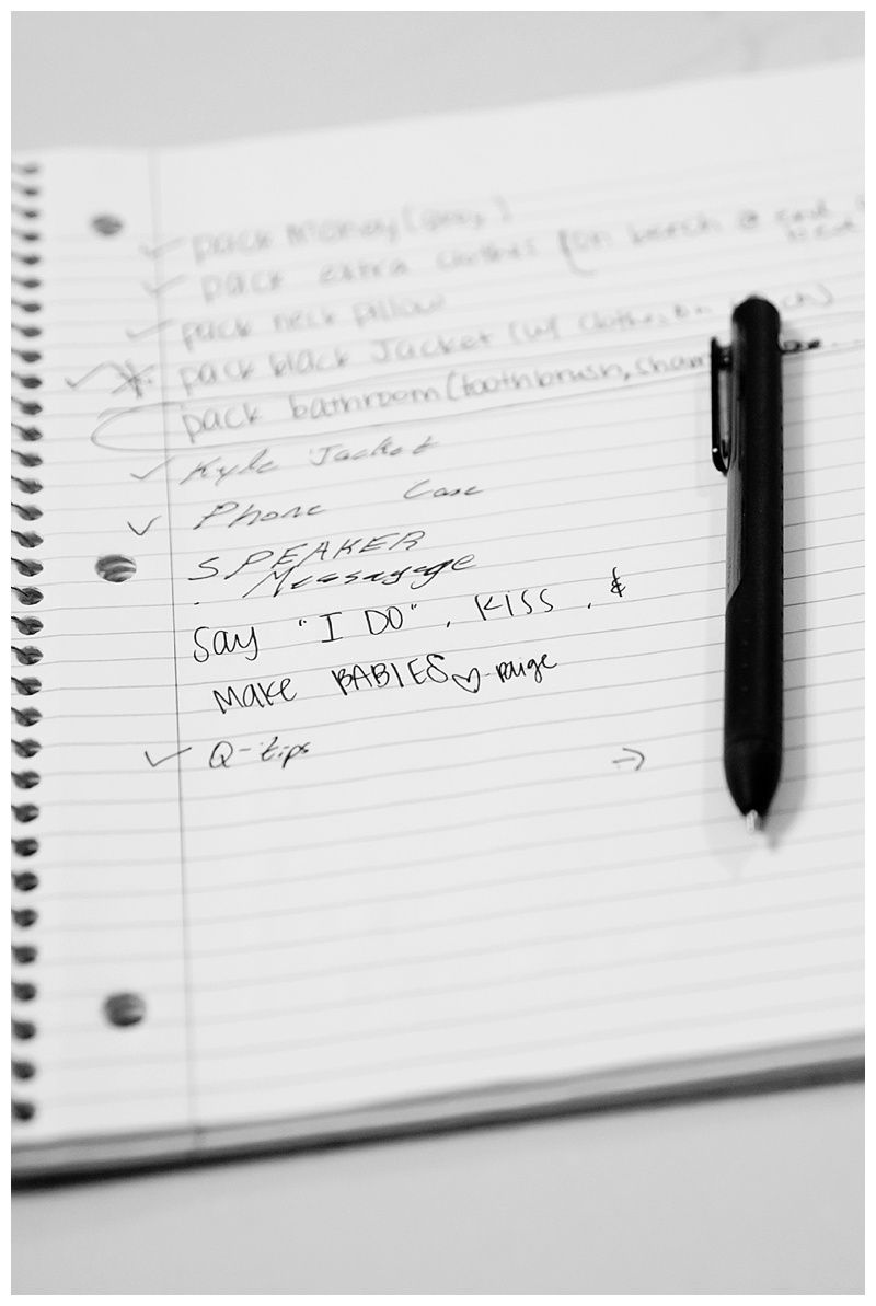 Black and white photo of handwritten wedding planning notes and checklist.
