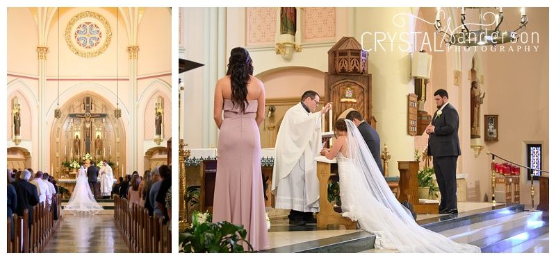 Church wedding ceremony in progress with decorative floral arrangements at the altar.