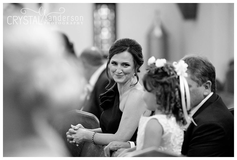 Black and white candid moments captured during an emotional church wedding ceremony.