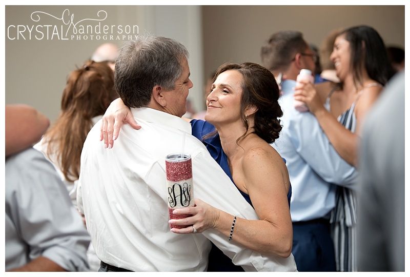 Casual reception moments with guests enjoying drinks and dancing.