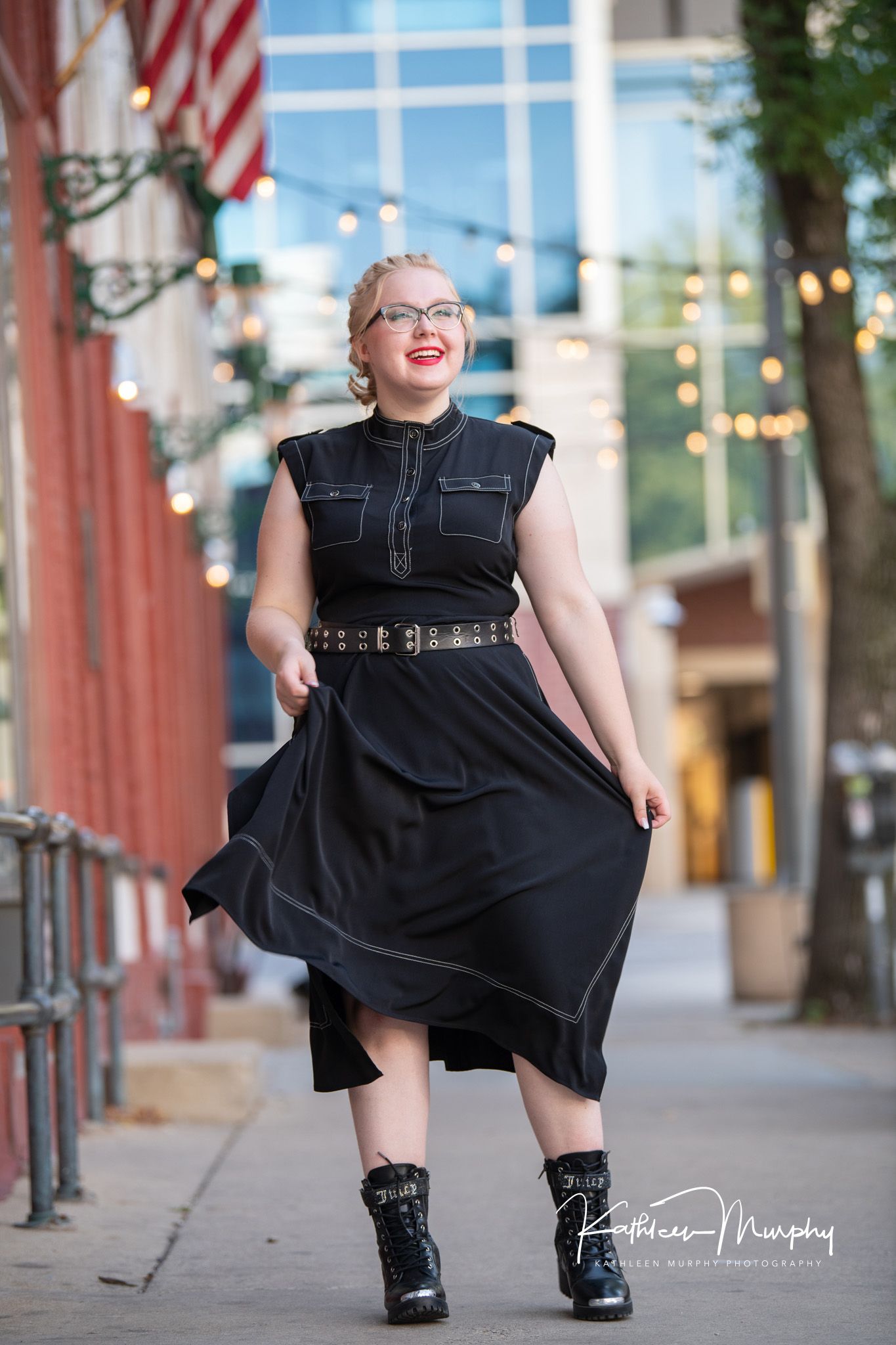 Kathleen Murphy Photography picture of a teen girl in a black dress in an urban setting