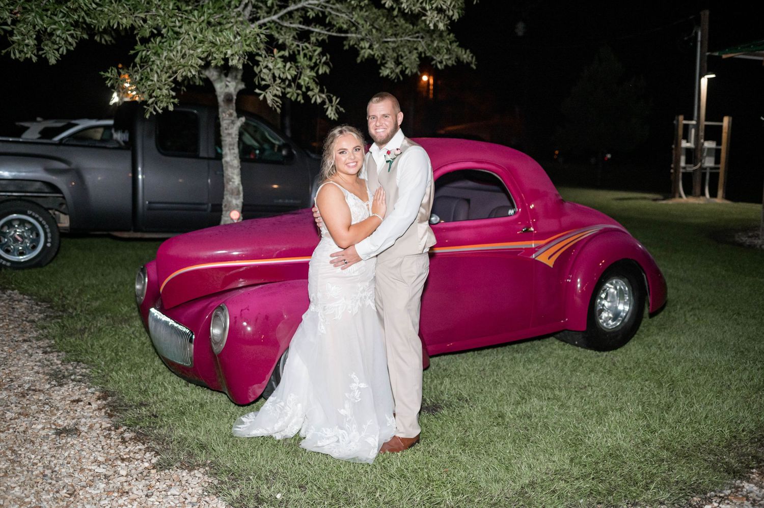 bride and groom with antique car