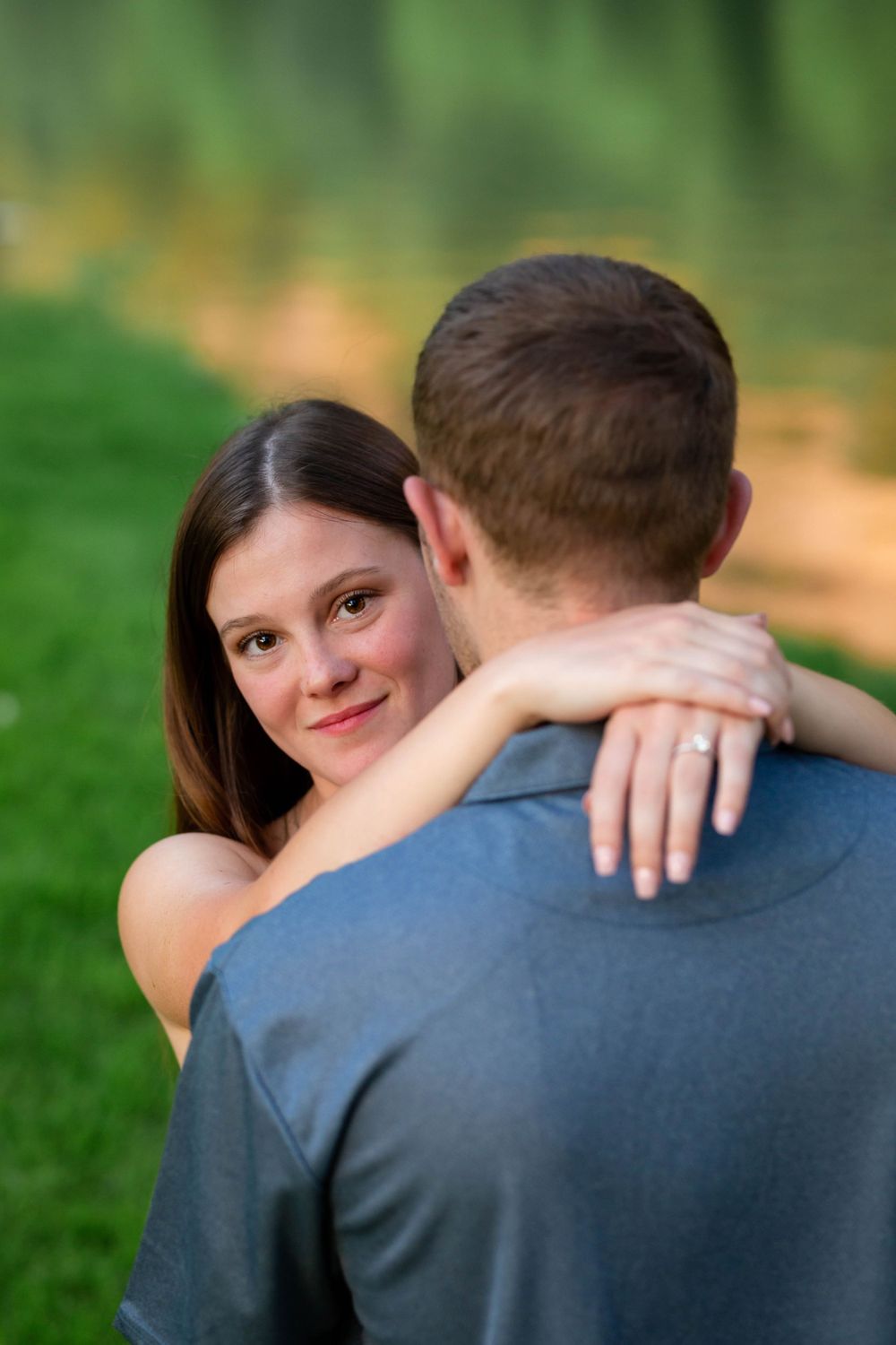 Engaged couple embracing by the Buffalo River near Mountain Home, Arkansas