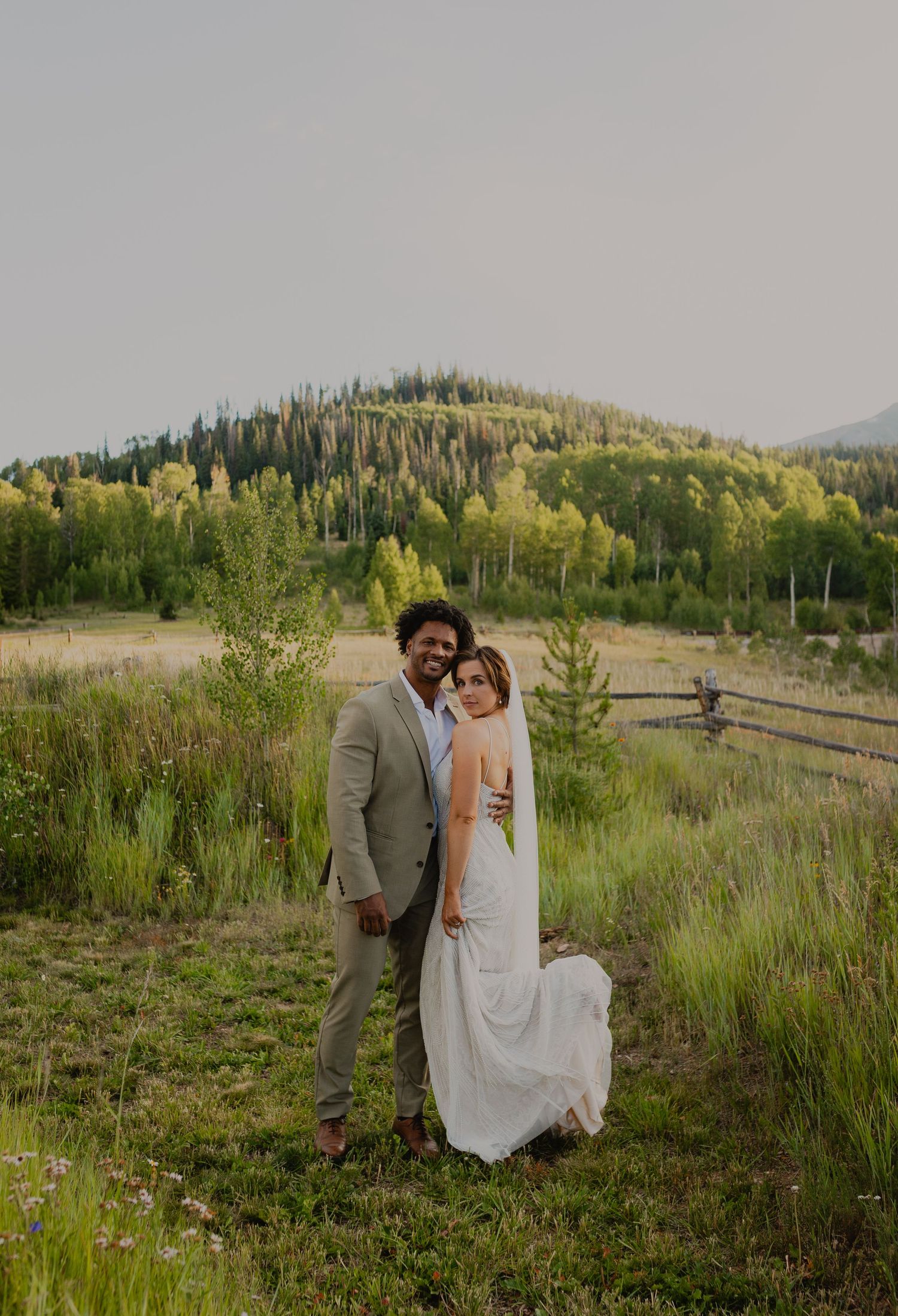 Artful capture by a Colorado elopement photographer, highlighting the couple's joy against the breathtaking backdrop of