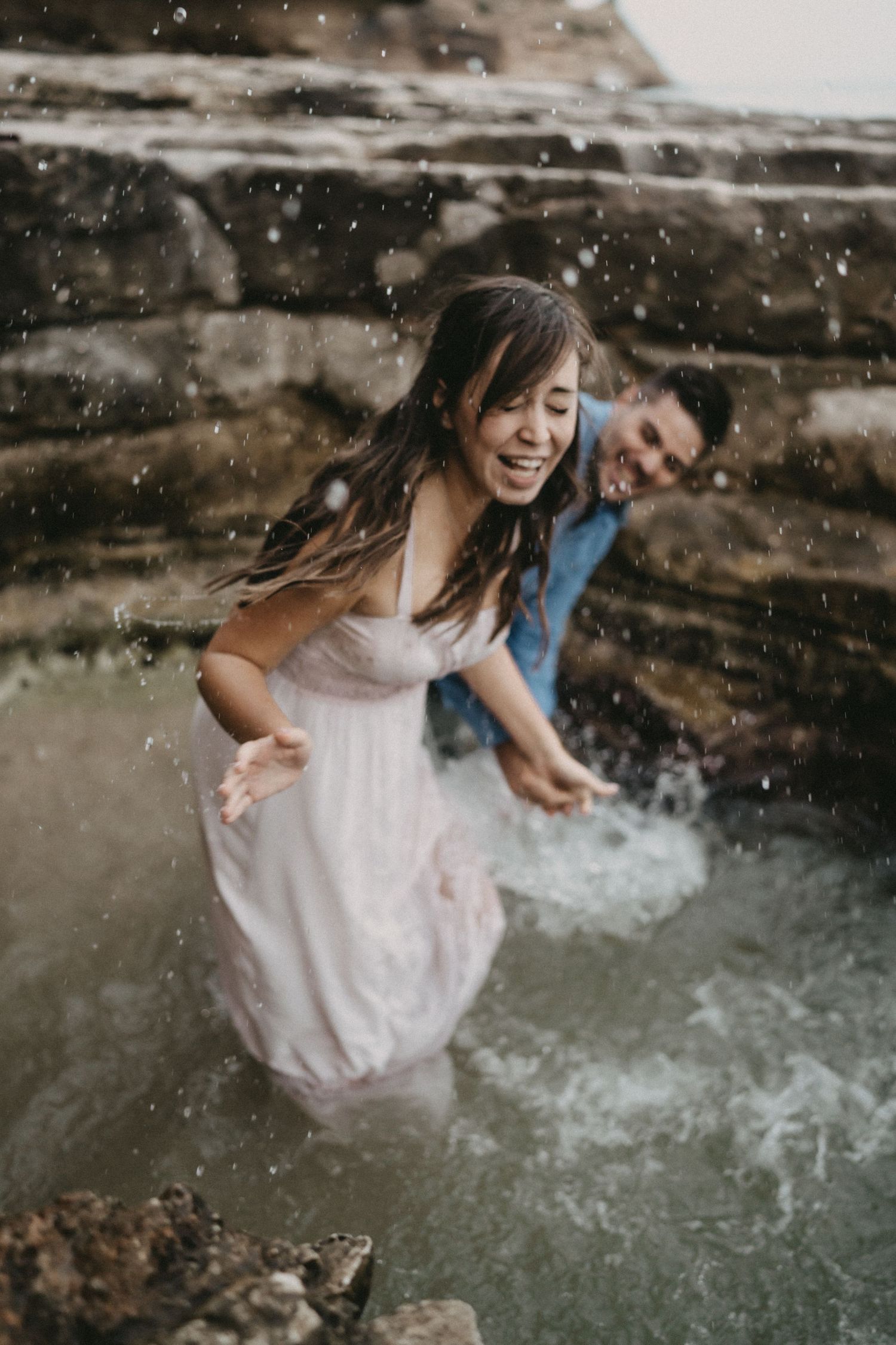 Joyful sequence of someone splashing and playing in water during a photo session.