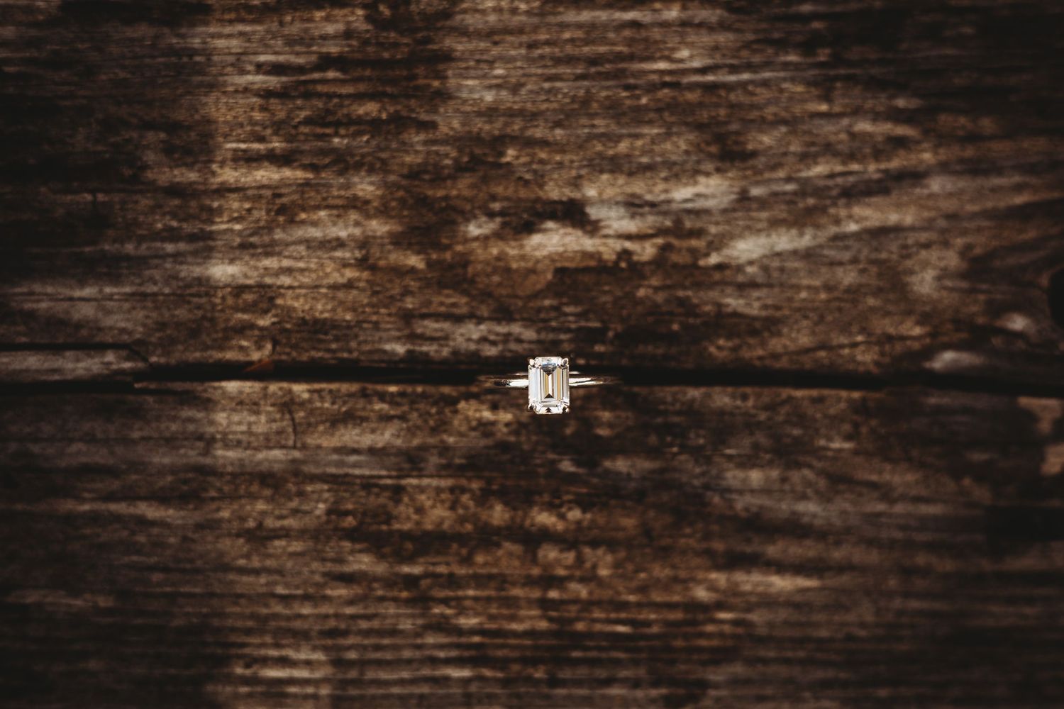 Weathered brown wooden background with natural distressed texture and grain details.