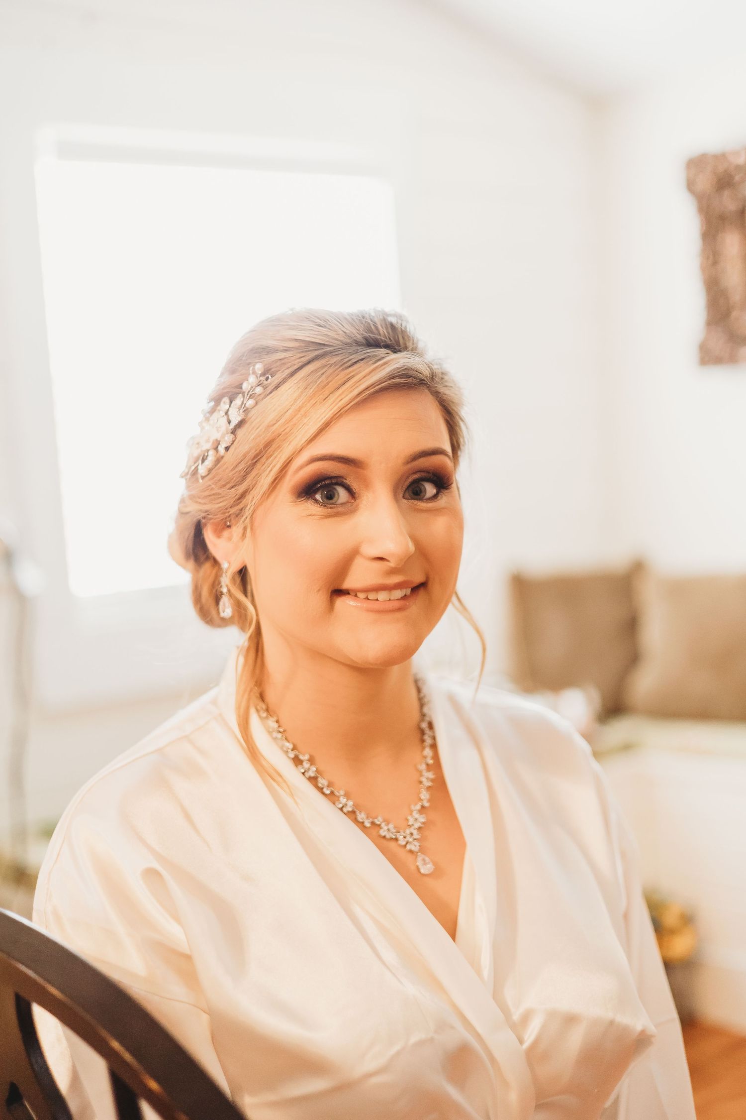 Joyful pre-wedding preparation scene with elegant bridal accessories.