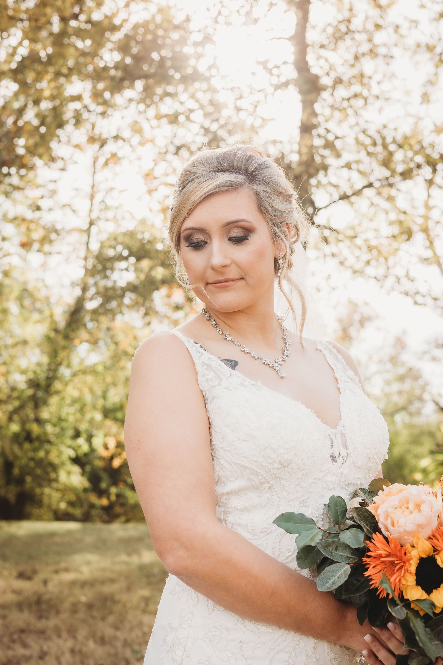 Soft natural light illuminates bridal portraits with elegant floral arrangements and lace details.
