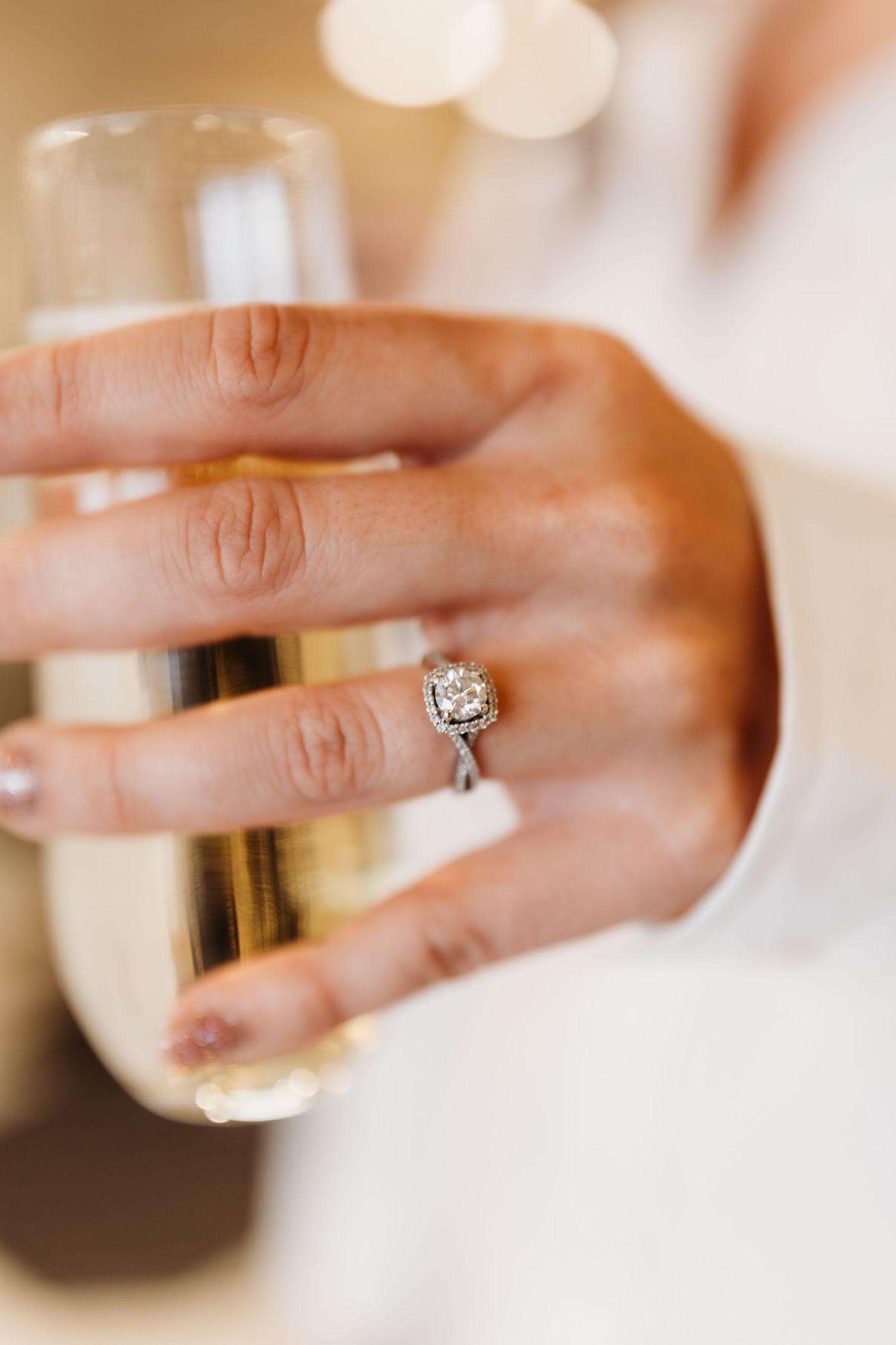 Close-up shots of engagement and wedding rings on hands.