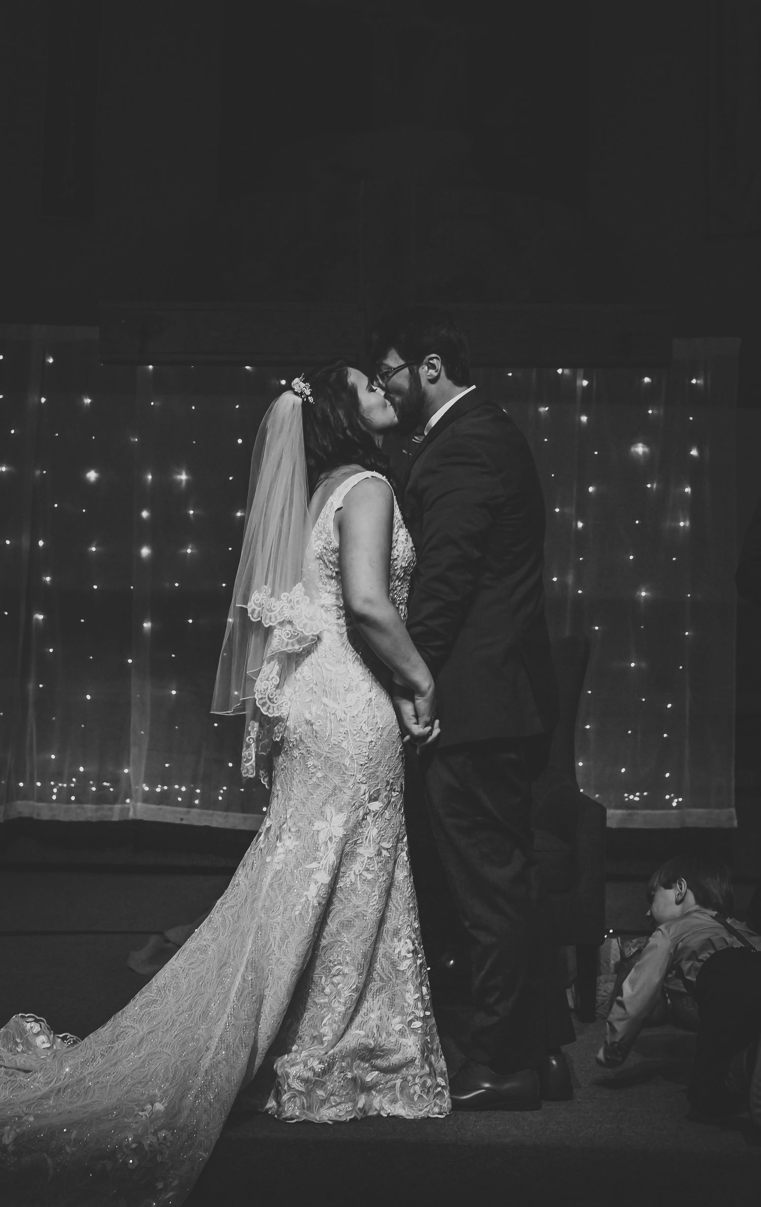 Silhouetted couple dancing against a backdrop of twinkling fairy lights.