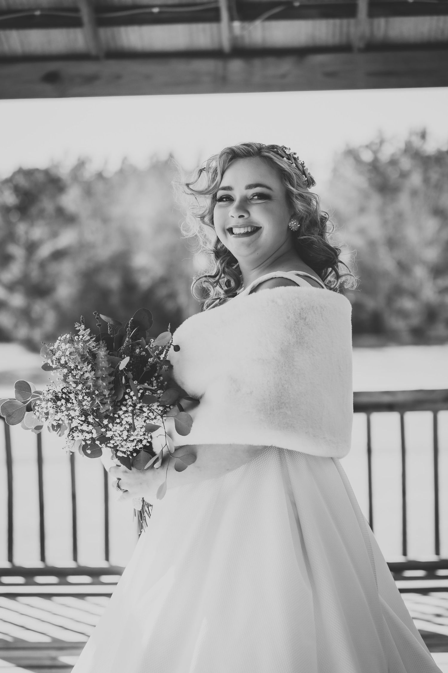 Black and white bridal portrait series showing joyful moments on covered porch.