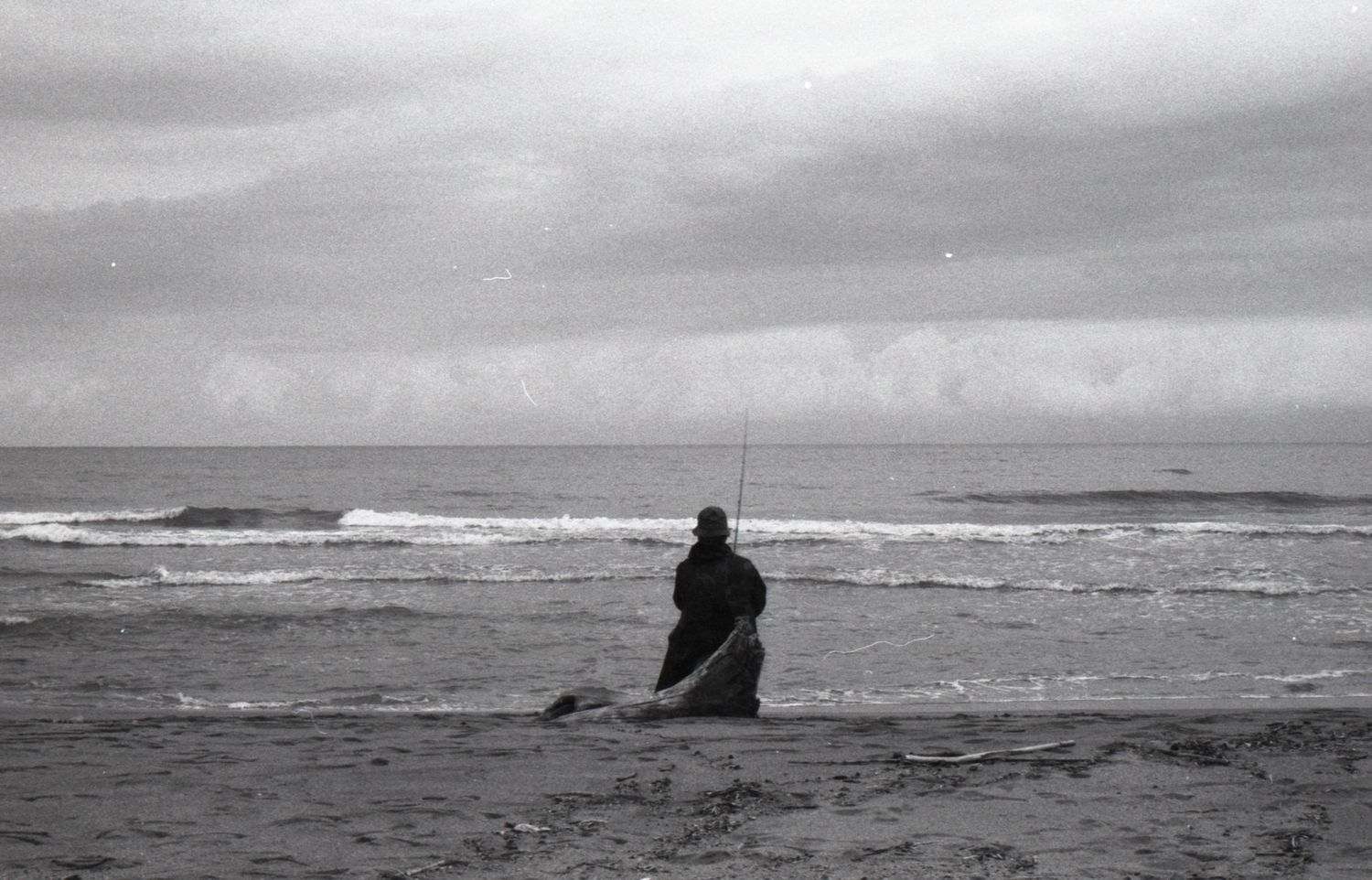 a fisherman in black & white