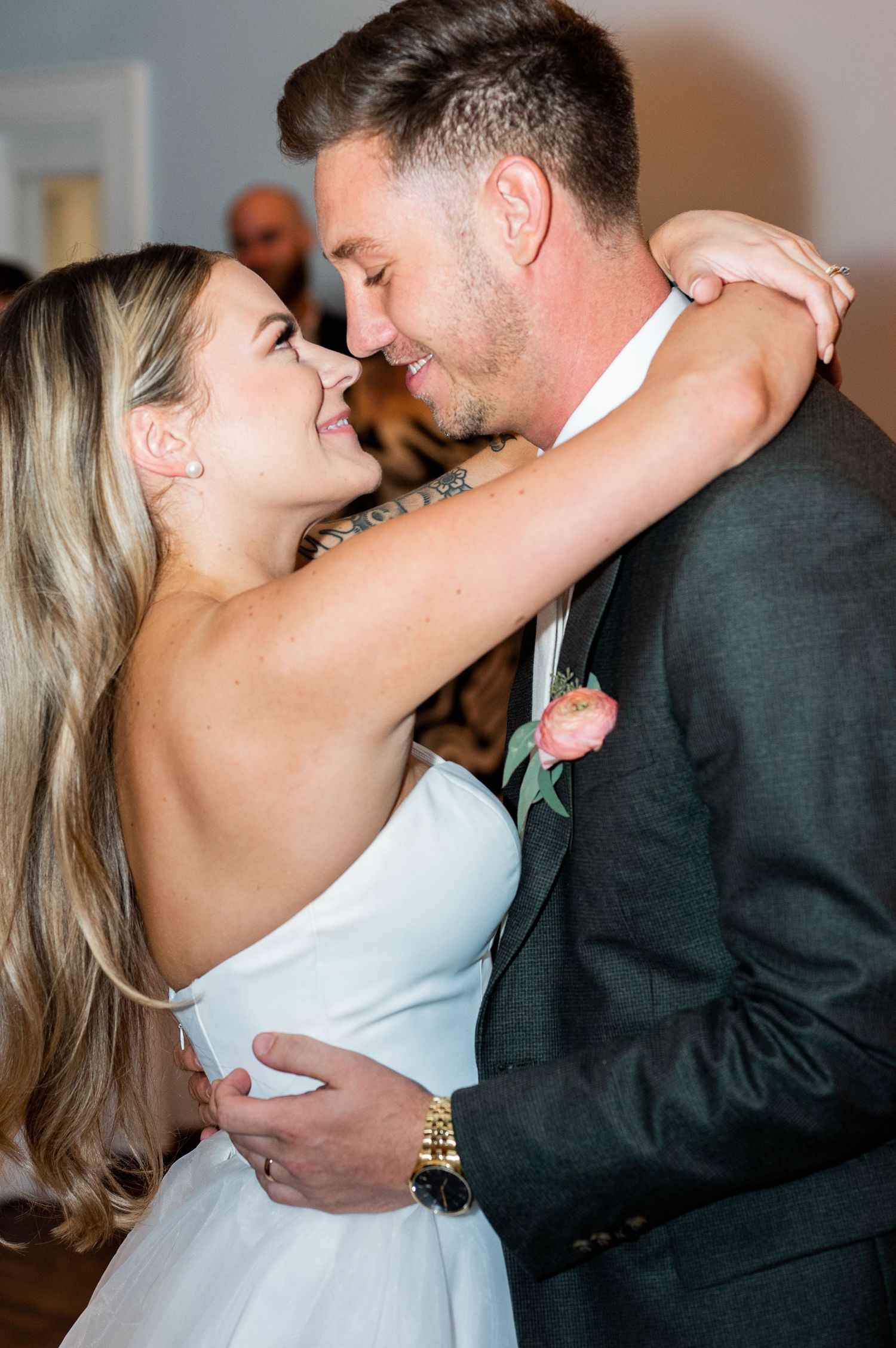 Couple sharing an intimate dance moment at their wedding reception.