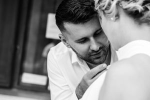 Intimate black and white portrait session with soft natural lighting.