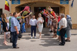 Guests line up outside a municipal building entrance for a celebration.