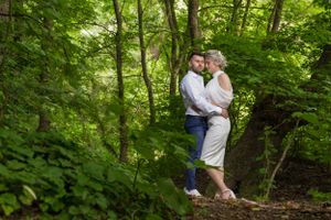 Romantic forest photo session with natural green backdrop.