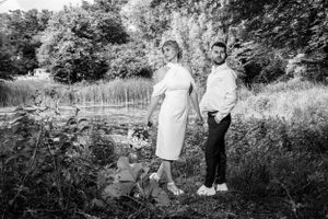 A black and white wedding photoshoot in a natural outdoor setting.
