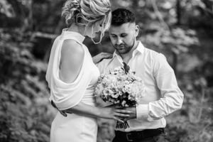 Black and white romantic portrait session in a natural outdoor setting.