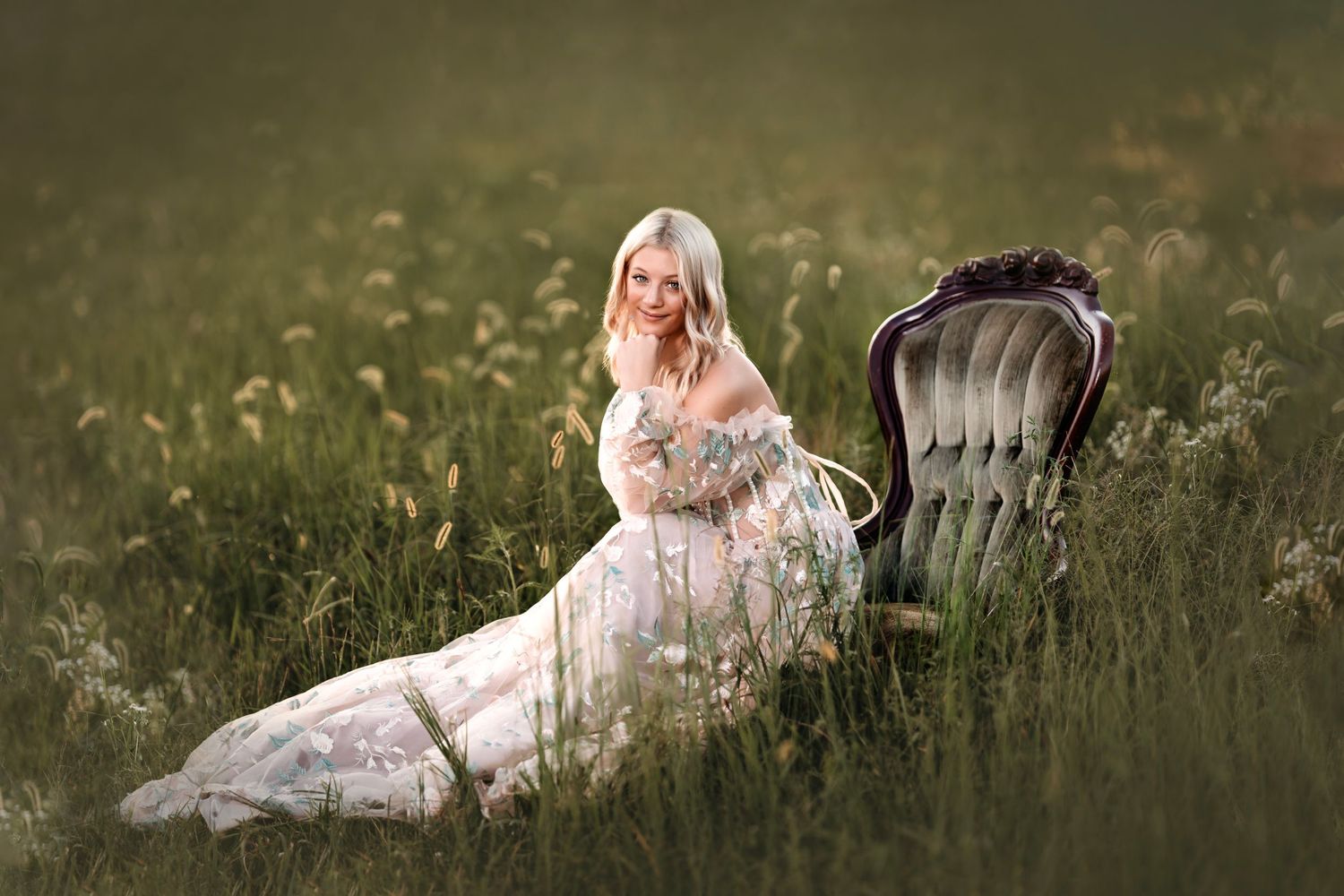 Dreamy outdoor portrait with vintage chair in wildflower meadow. Middle TN senior photographer