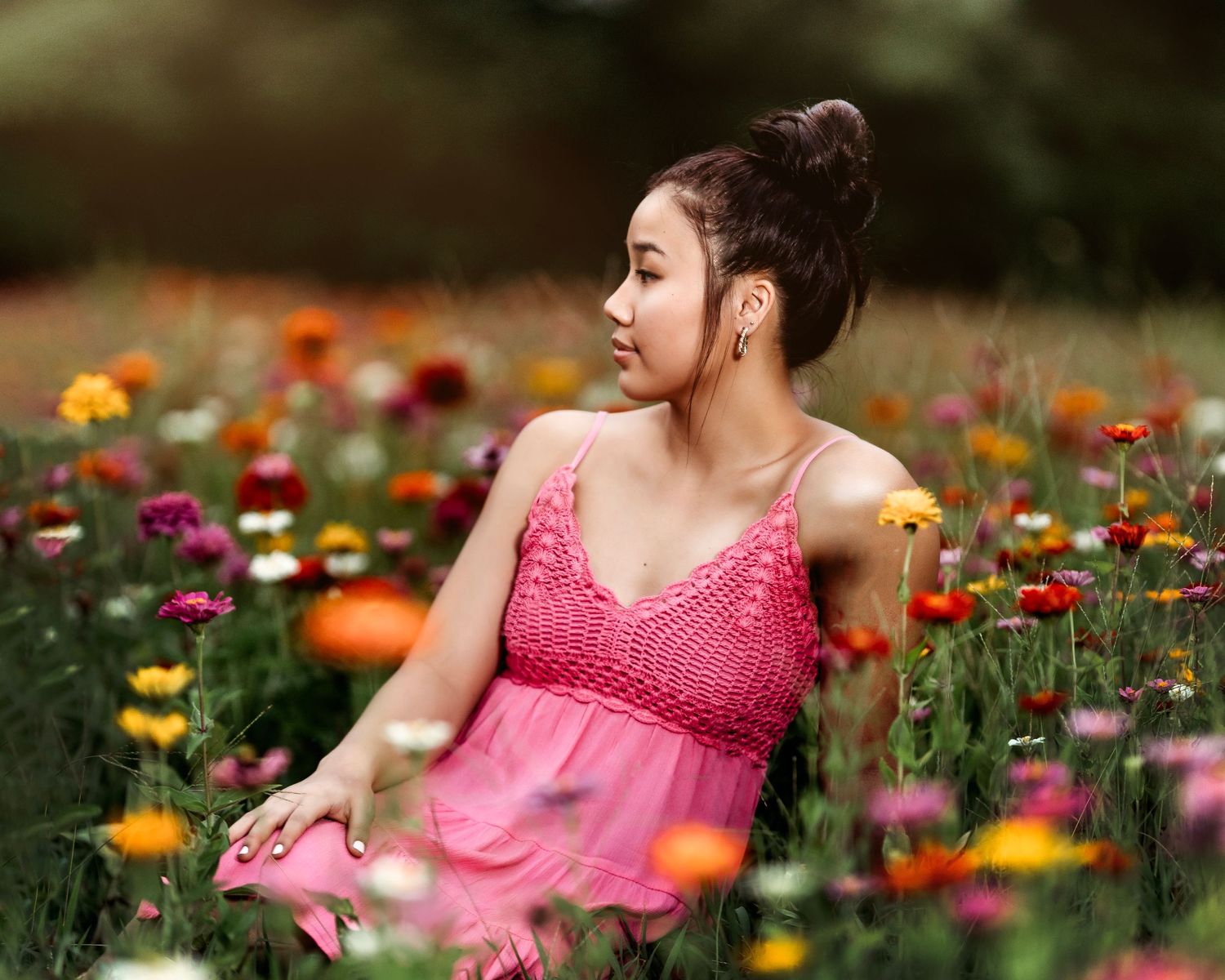 Portrait session in colorful wildflower field wearing pink dress. Middle TN senior photographer