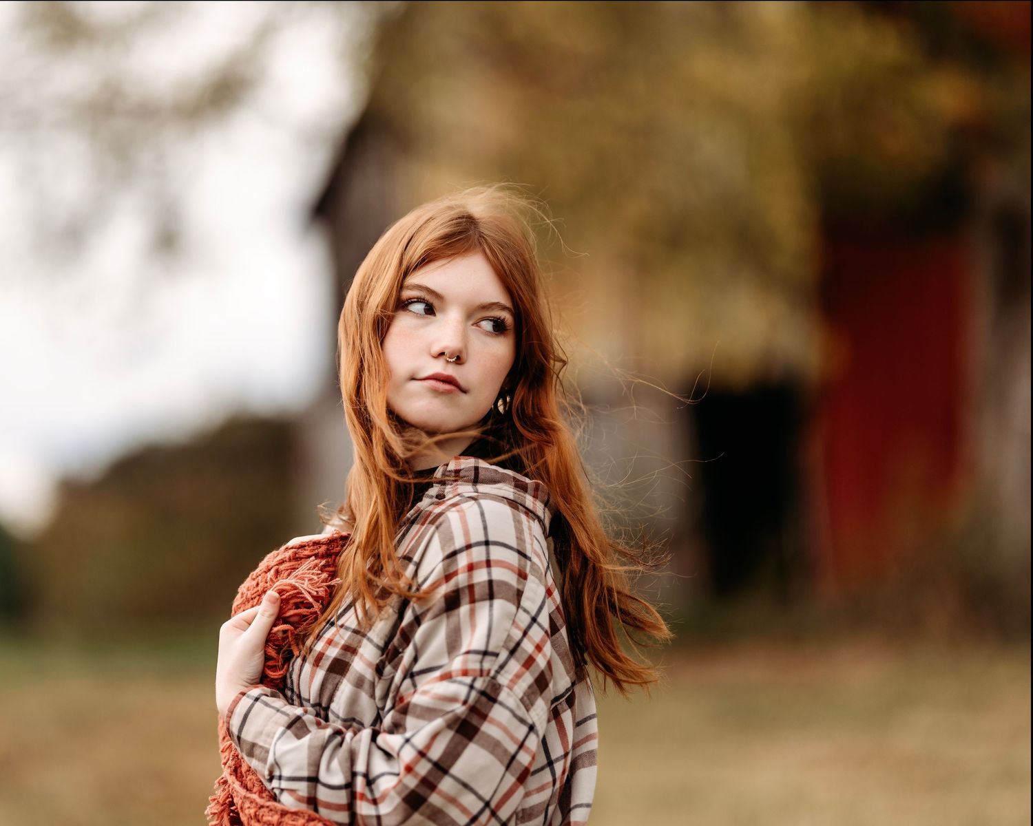 Portrait series in autumn setting featuring plaid shirt and natural lighting. Middle TN senior photographer