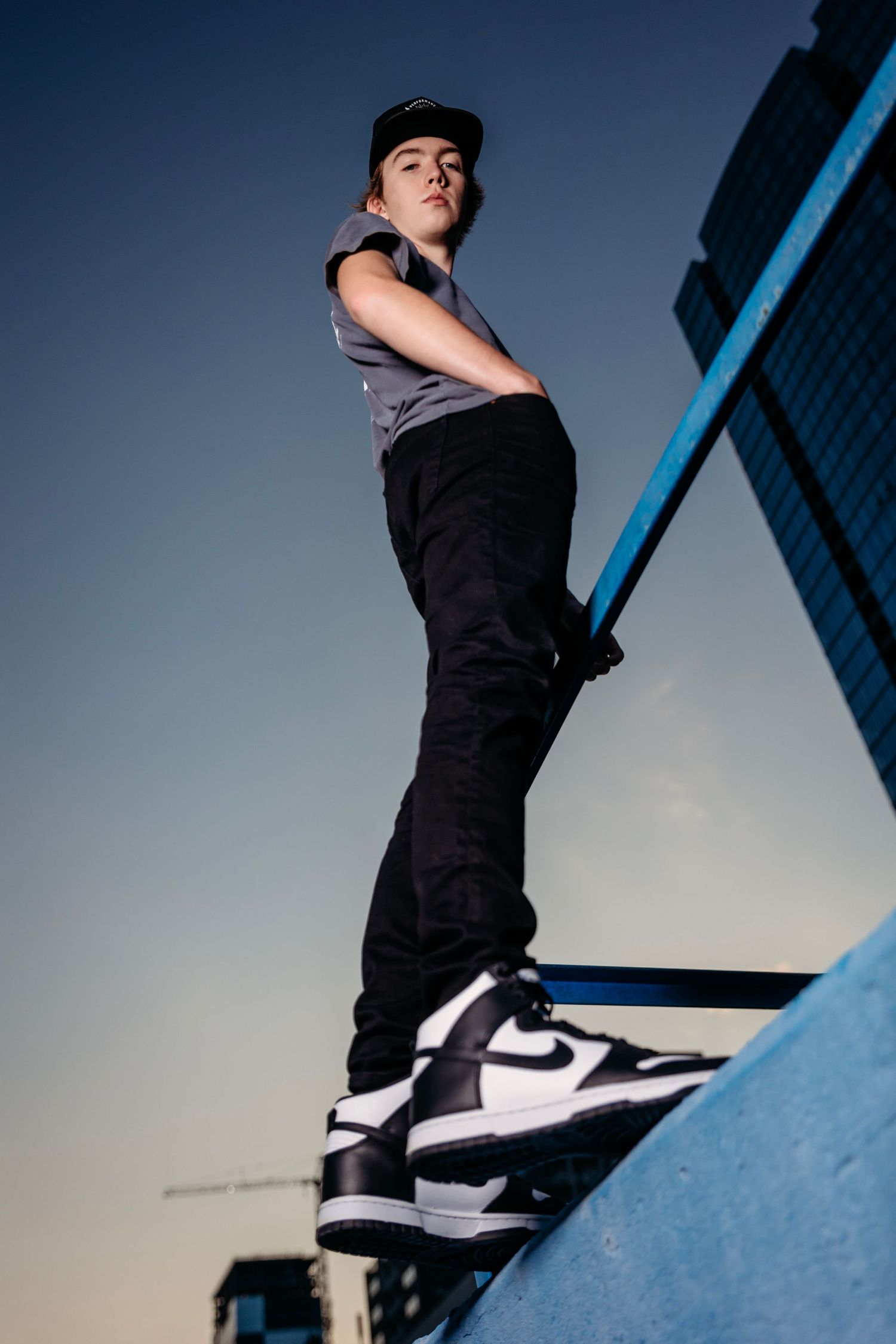 Dynamic low angle shots against blue sky with architectural elements. Middle TN senior photographer