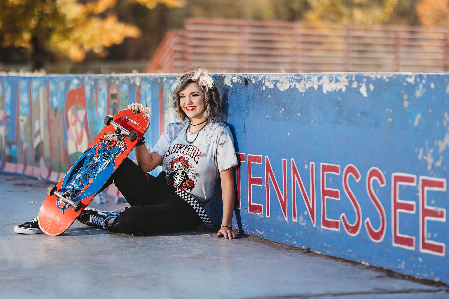 Skateboarding action shots against a blue wall with Tennessee text. Middle TN senior photographer