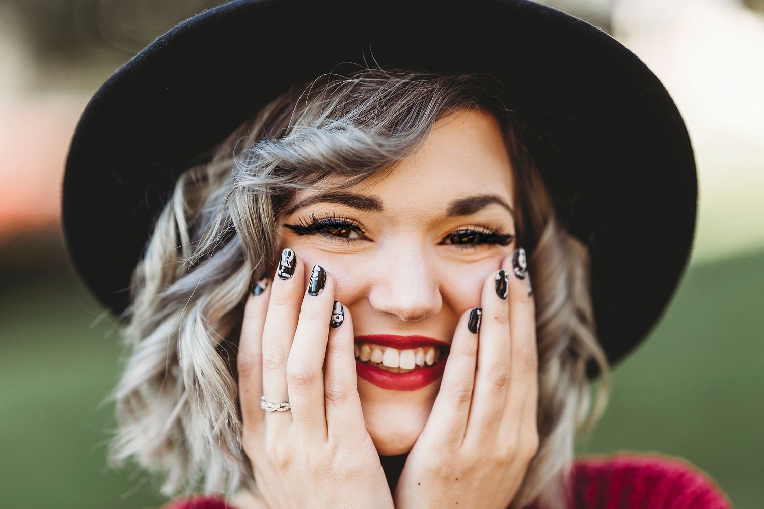 Expressive portrait series showing joy and laughter while wearing a black hat. Middle TN senior photographer